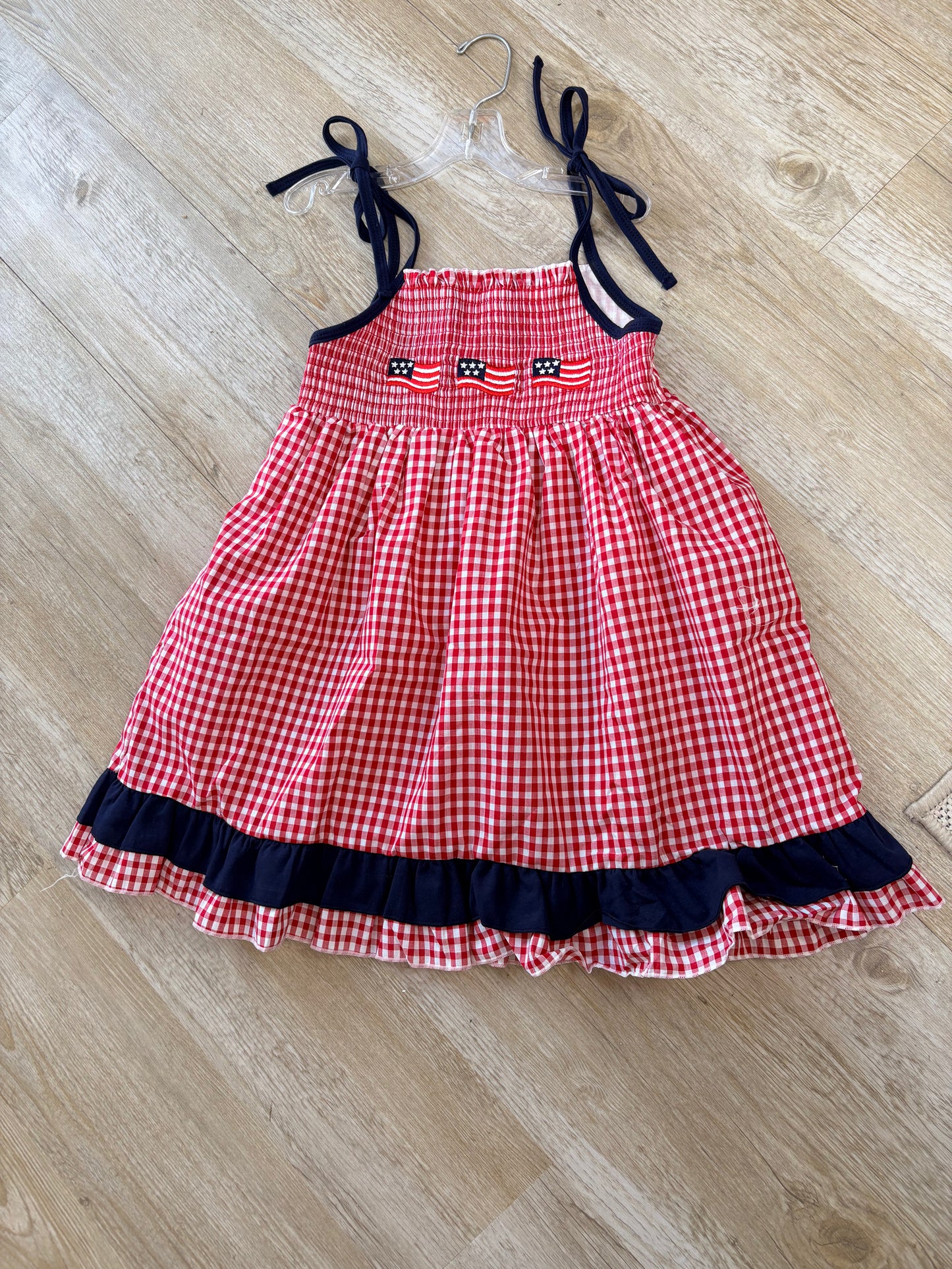 Red smocked gingham ruffle dress