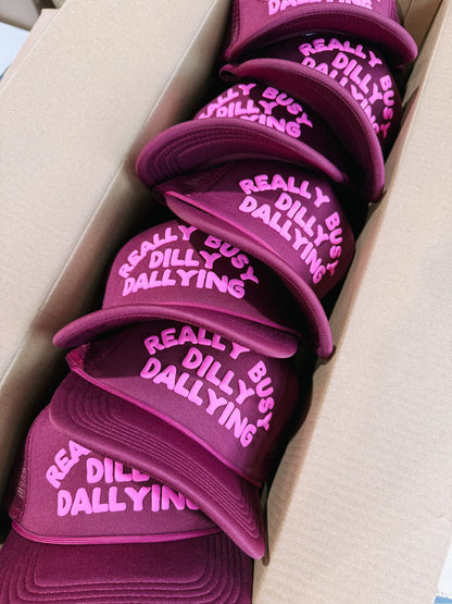 Dilly Dallying trucker hat- burgundy/pink